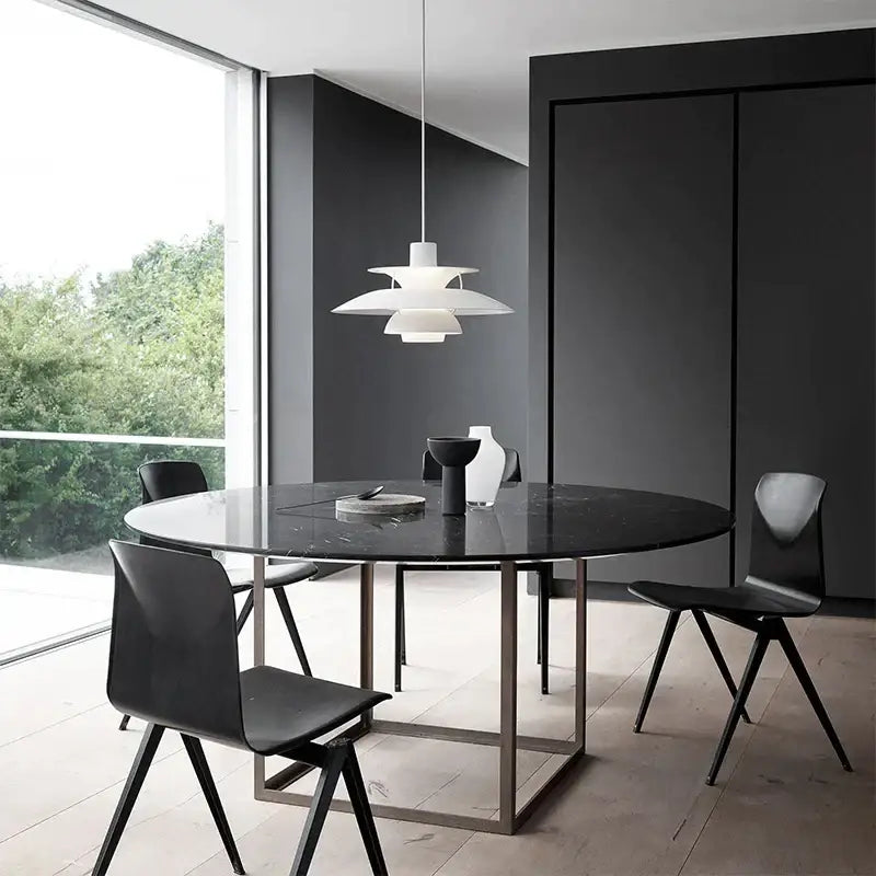 White layered modern geometric pendant light hanging above dining table in decorbites colorful umbrella pendant collection