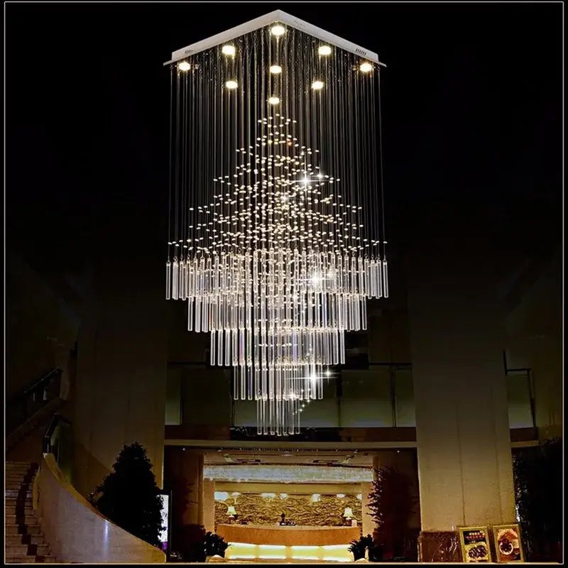 A modern decorbites columnar crystal chandelier with cascading rods and lights in white for living room decor