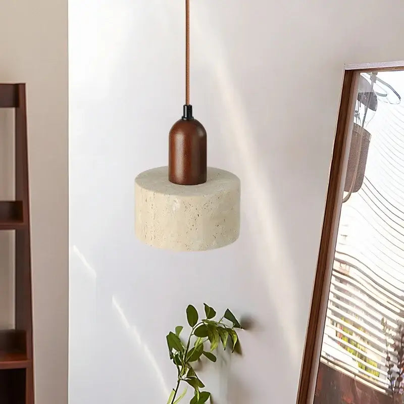 Minimalist pendant light with cylindrical concrete base, warm brown wood top, and copper cord for modern decorbites led yellow travertine