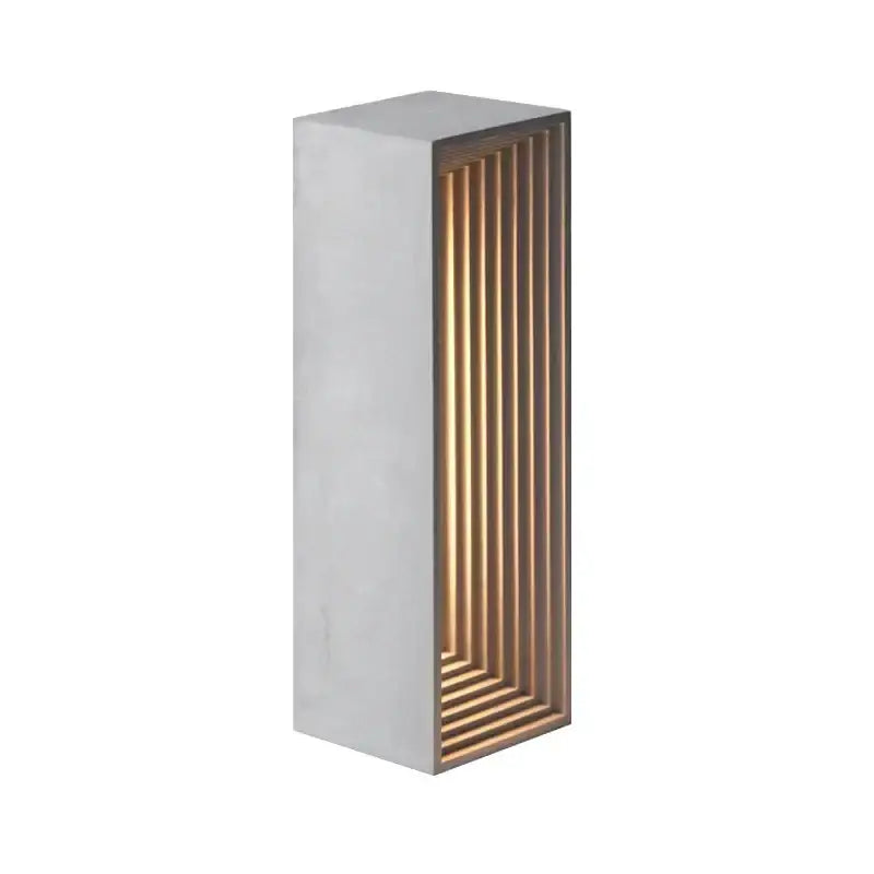 Modern concrete stone table lamp with matte white concrete exterior and amber led lighting behind wooden slats decorbites concrete stone