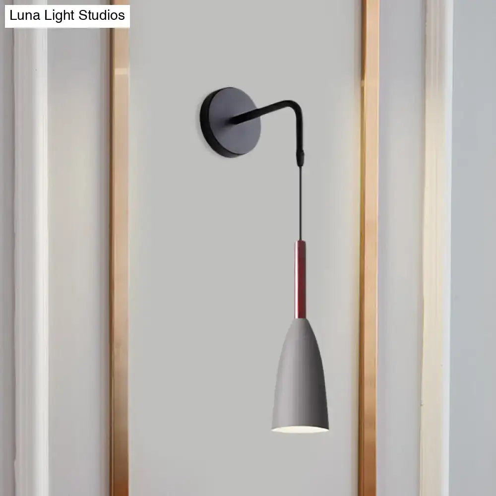Modern conical black wall lamp with matte black base, curved arm, and gray shade with red stripe 8 inch fixture