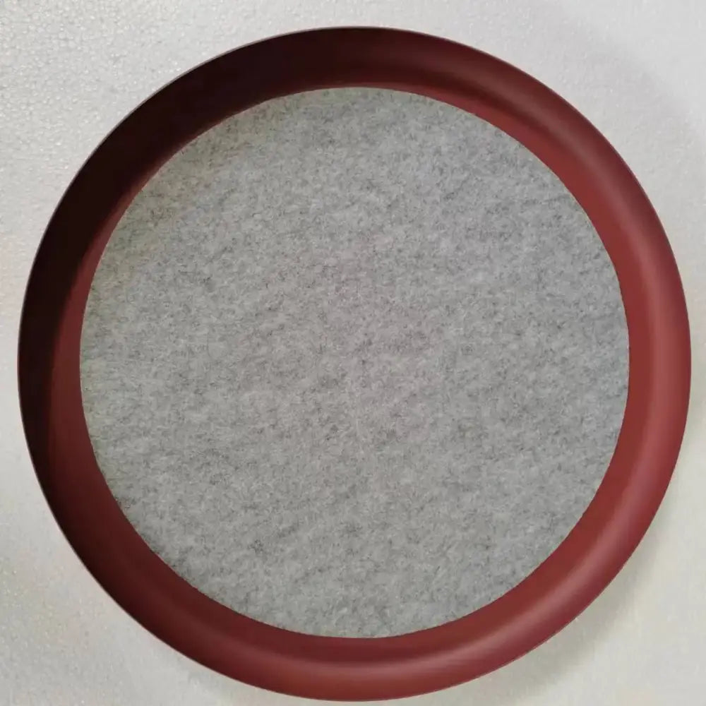 Circular red-framed mirror with gray textured fabric backing shown alongside modern copper and black decorbites grid led pendant light