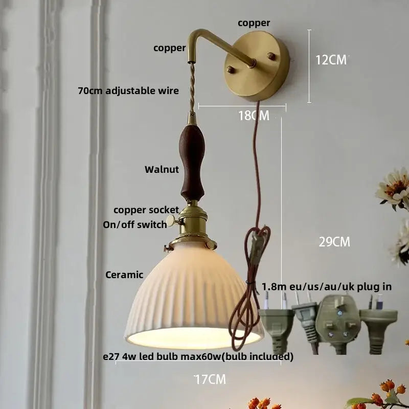 Modern copper wall light fixture with walnut handle, off-white ceramic shade, and adjustable wire for bedroom use