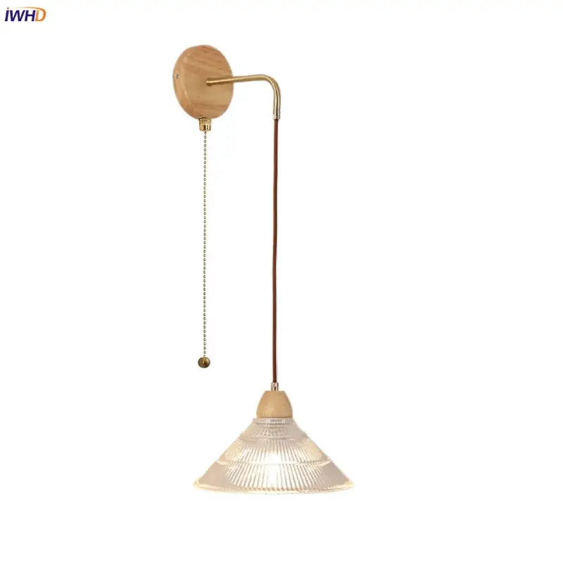 Modern copper and wood wall sconce with clear glass ribbed shade and pull chain switch for easy lighting control