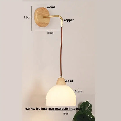 Modern copper and wood wall sconce with natural wood base, frosted glass shade, and clear glass pull chain switch