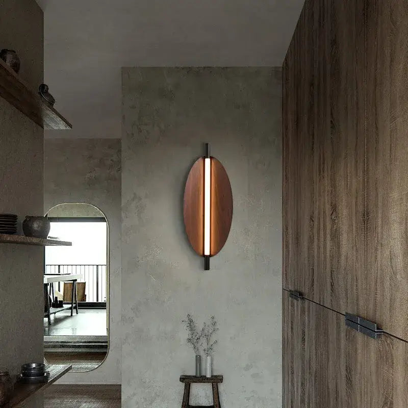 Modern copper brown metal leaf wall sconce with sleek vertical light strip for bedroom decorbites brown metal lighting