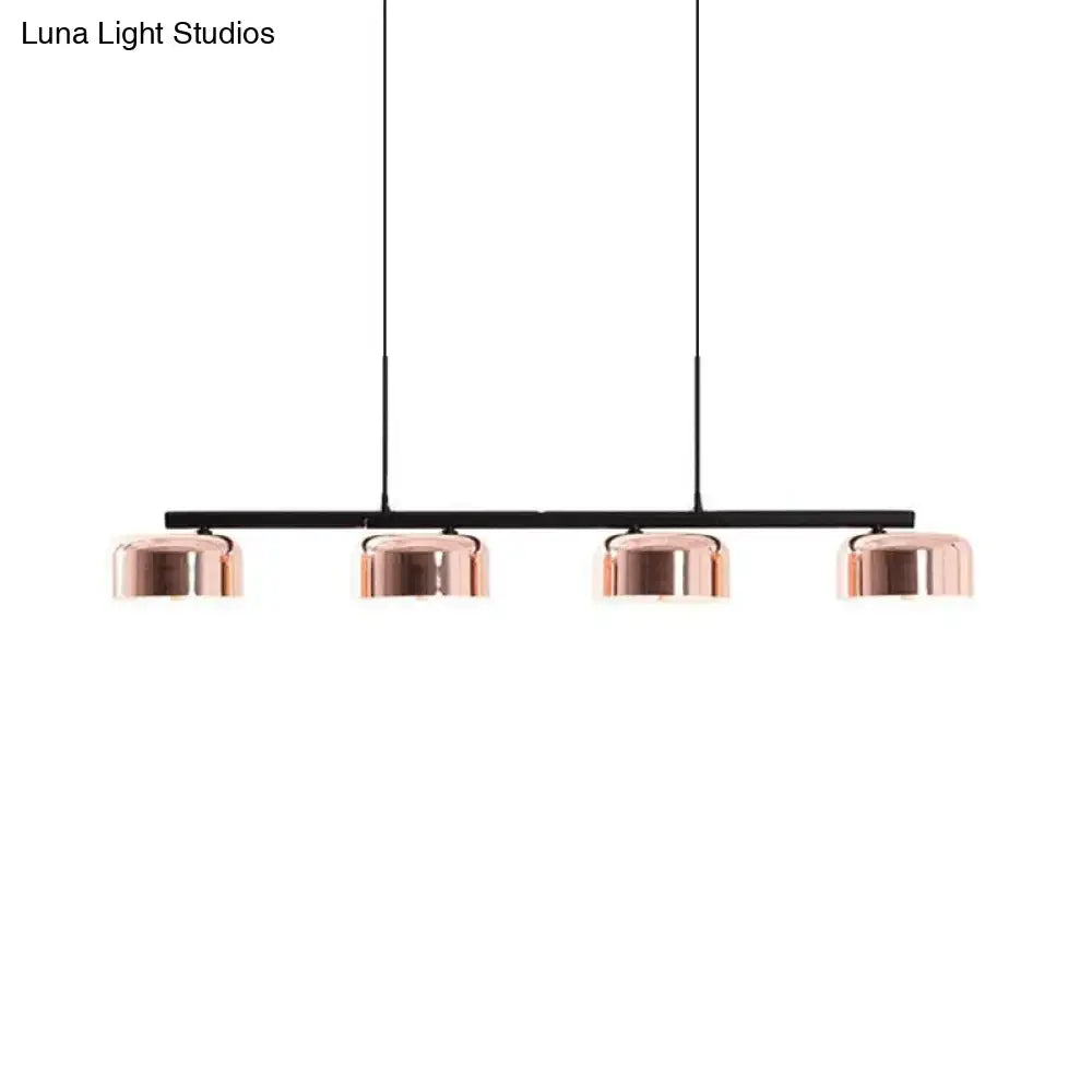 DecorBites™ contemporary copper ceiling light with four dome-shaped lampshades on a sleek black bar for dining room