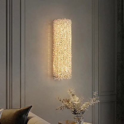 Modern copper crystal wall sconce with clear sparkling crystals emitting warm golden glow for living room decorbites crystal wall lighting