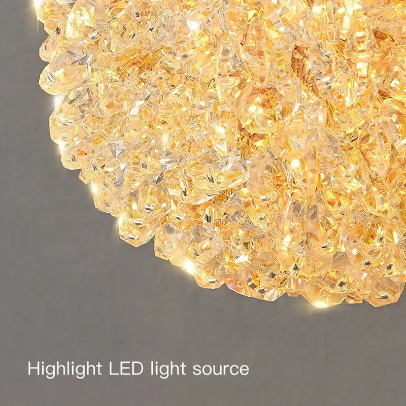 Modern copper crystal wall sconce with a golden faceted crystal design and glowing led light for living room decorbites crystal wall