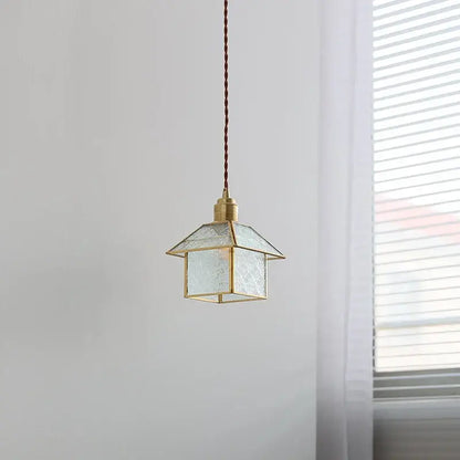 Modern copper cube glass led pendant light with brass frame, textured translucent shade, and braided brown cord decorbites cube glass