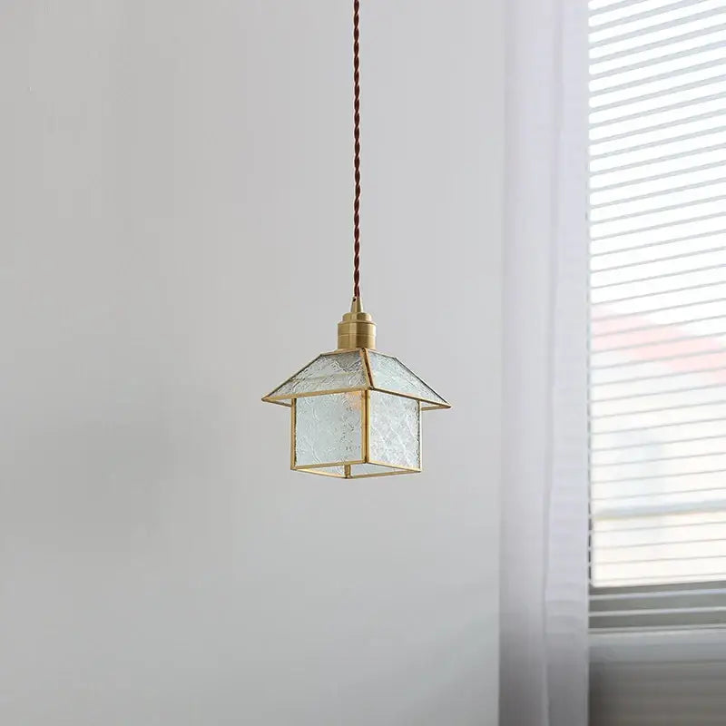 Modern copper cube glass led pendant light with brass frame, textured translucent shade, and braided brown cord decorbites cube glass