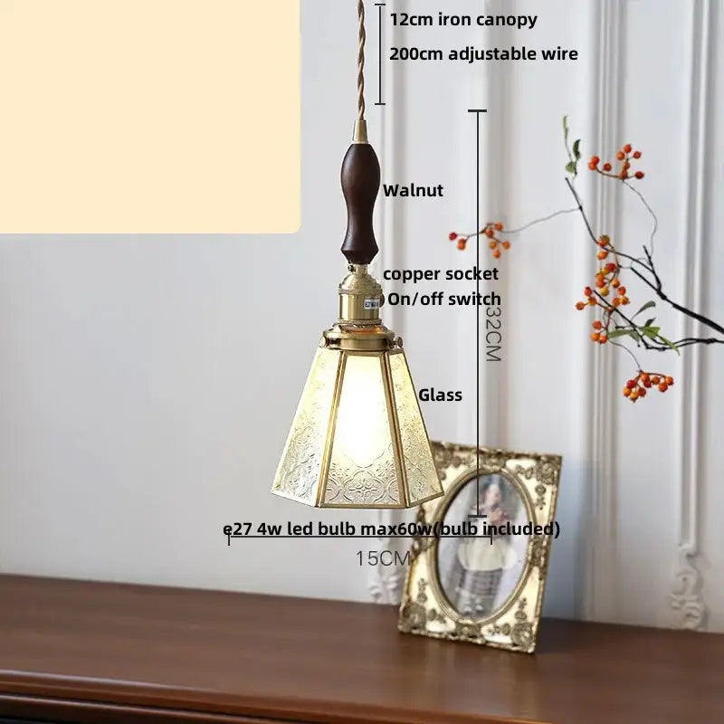 Vintage-style pendant light with walnut wooden handle brass accents and ornate etched glass shade perfect for bedroom decorbites cube glass led
