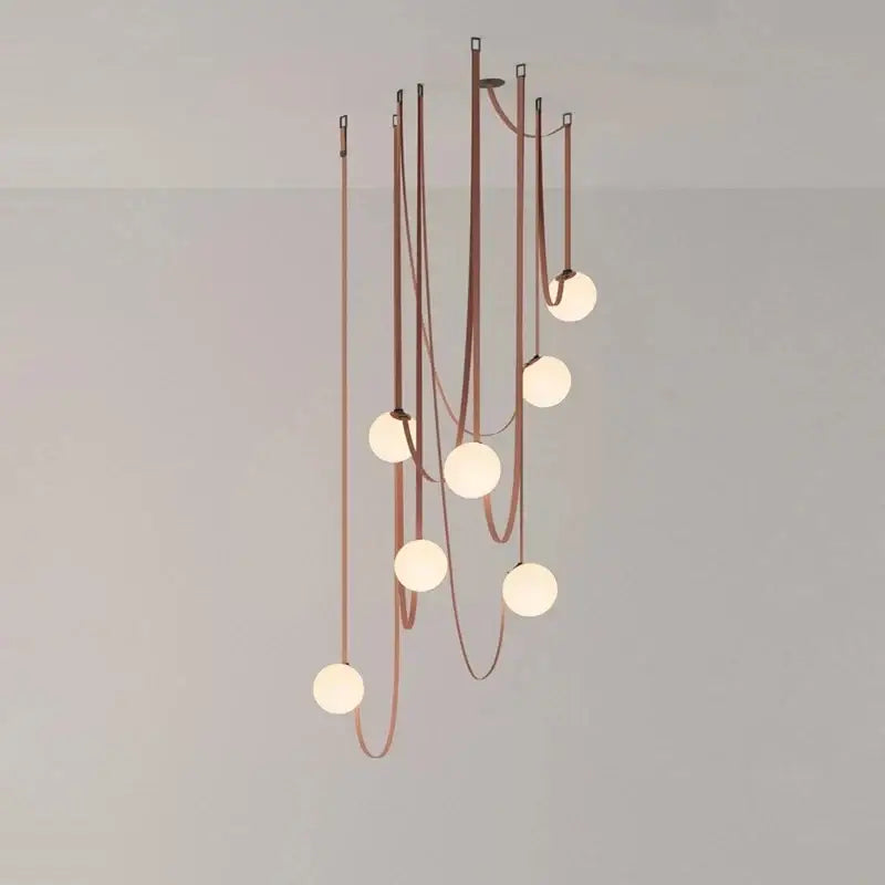 A modern copper decorbites glass ball pendant lamp with seven frosted glass bulbs for dining room lighting