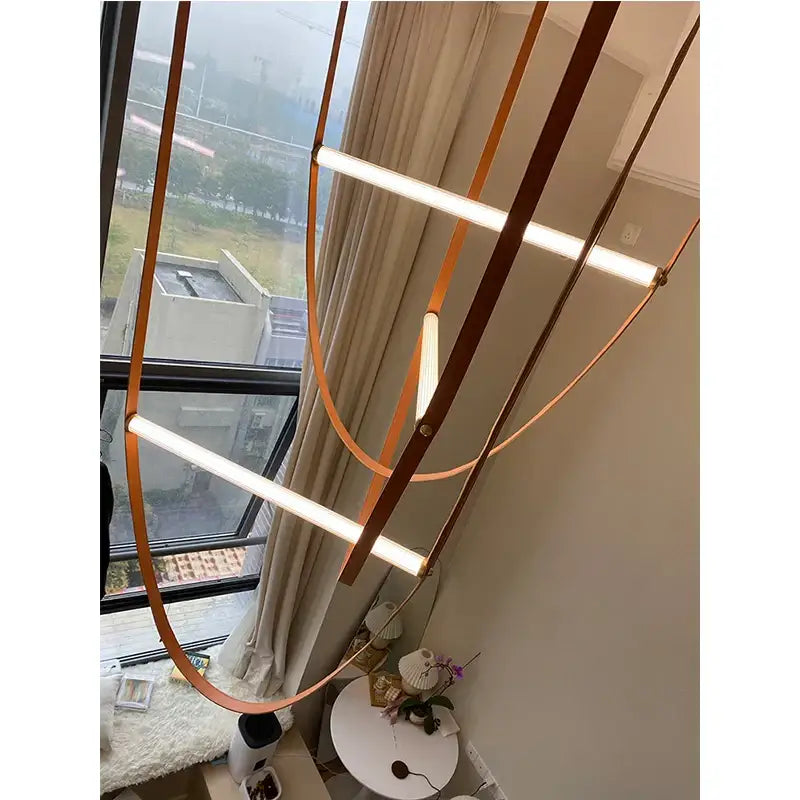 Modern copper decorbites leather belt chandelier with curved metal bands and integrated white led strips for dining room