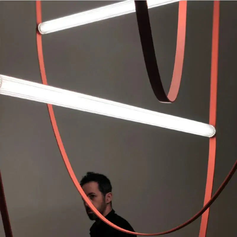 Modern copper decorbites leather belt chandelier with glowing white led tubes and orange curved bands for dining room