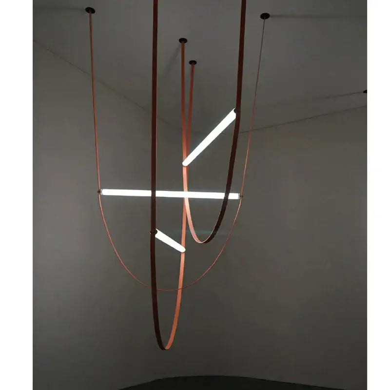 Modern copper decorbites leather belt chandelier with sleek curved bands and integrated led tubes for dining room lighting