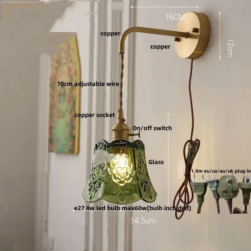 Antique brass-finished copper wall lamp with green etched glass shade and floral detailing led wall light fixture