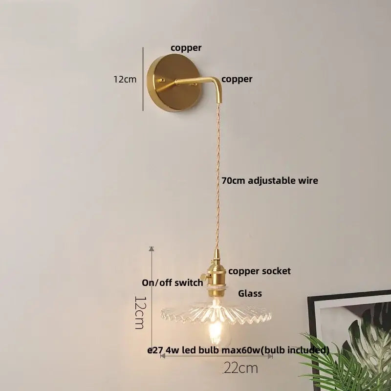 Modern gold-toned copper led wall light fixture with a clear glass shade and 70cm adjustable wire for bedroom use