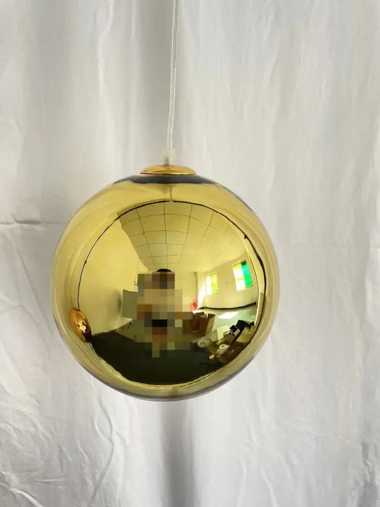 Modern copper glass balls pendant light featuring a sleek spherical gold glass balls pendant design for kitchen decorbites