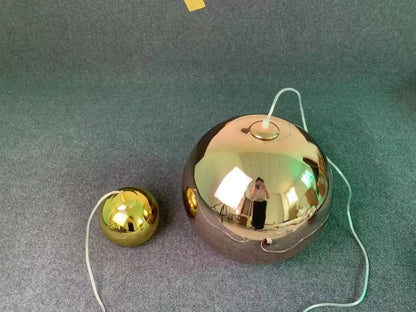 Modern copper glass balls pendant light featuring shiny gold spherical decorbites glass balls with reflective surfaces and white cords