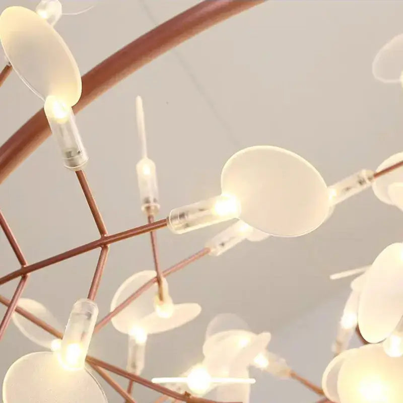 A delicate copper-toned modern heracleum chandelier with translucent disc-shaped lights for dining room decorbites heracleum chandelier