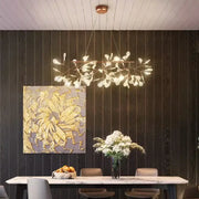 A modern copper heracleum chandelier with delicate leaf-shaped light fixtures for elegant dining room decor