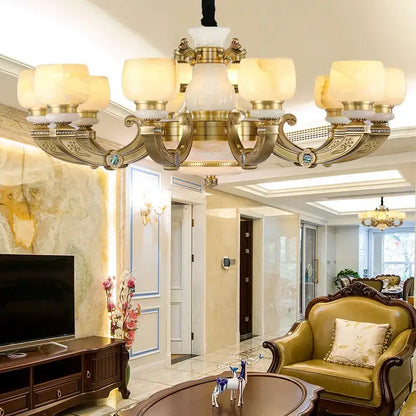 Gold-toned copper jade chandelier with ornate detailing and frosted glass shades for living room lighting