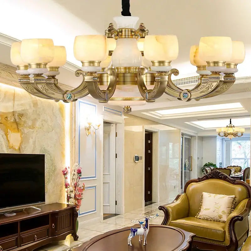 Gold-toned copper jade chandelier with ornate detailing and frosted glass shades for living room lighting