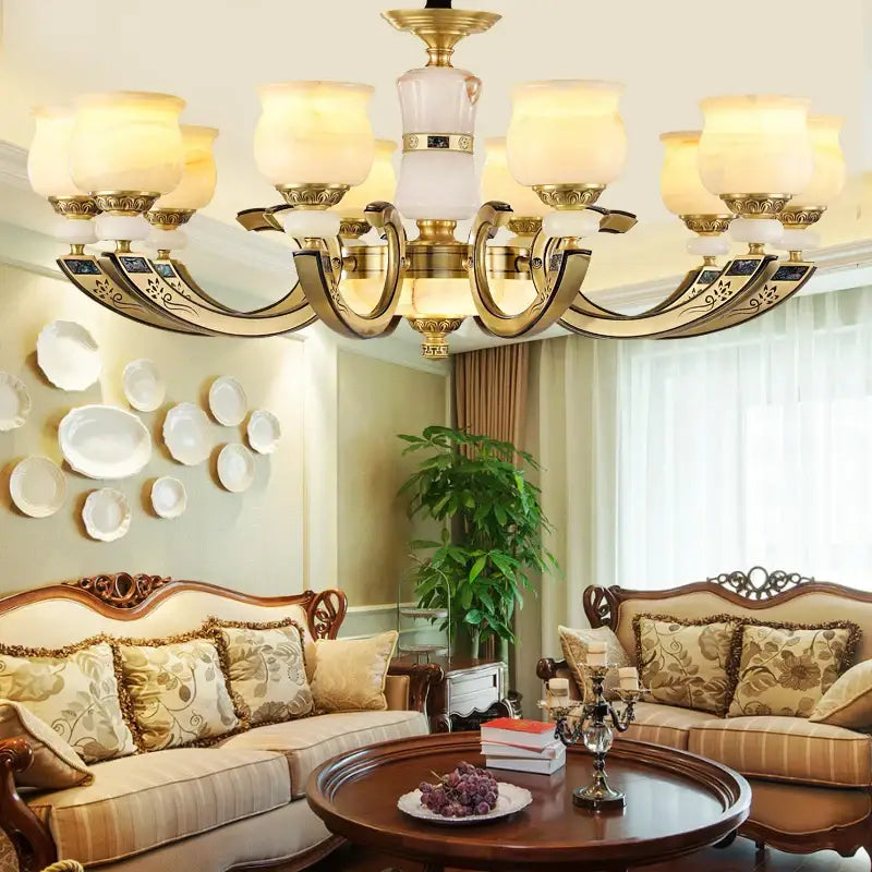 Modern copper jade pendant lamp with gold-toned ornate metal arms and frosted glass shades for dining room decorbites decor