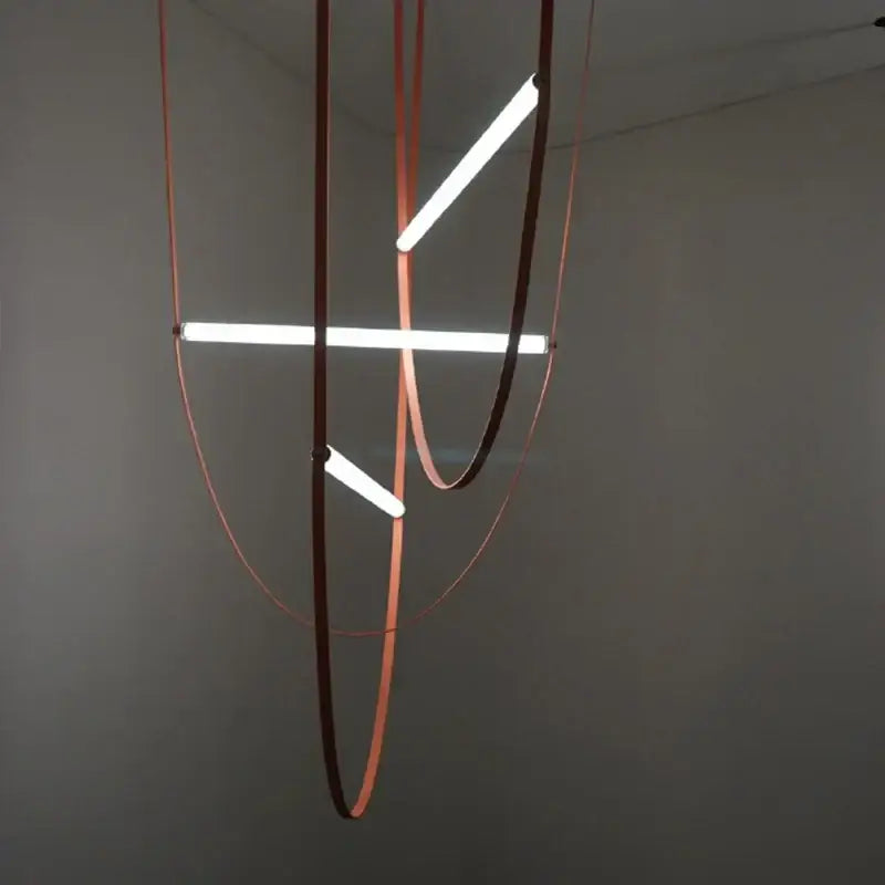 Modern copper leather bell pendant light with three glowing white led tubes and dark brown circular frames pendant light