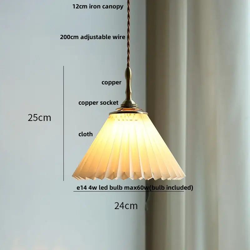 A warm glowing copper led pendant lamp with a pleated off-white fabric shade for dining room decorbites copper led