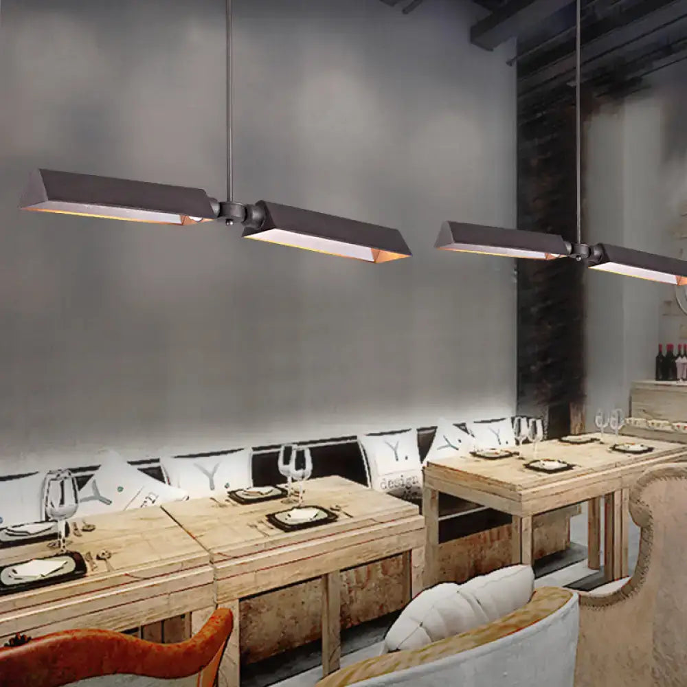 Modern copper metal triangle island pendant light with black rectangular metal triangle pendant light and warm illumination
