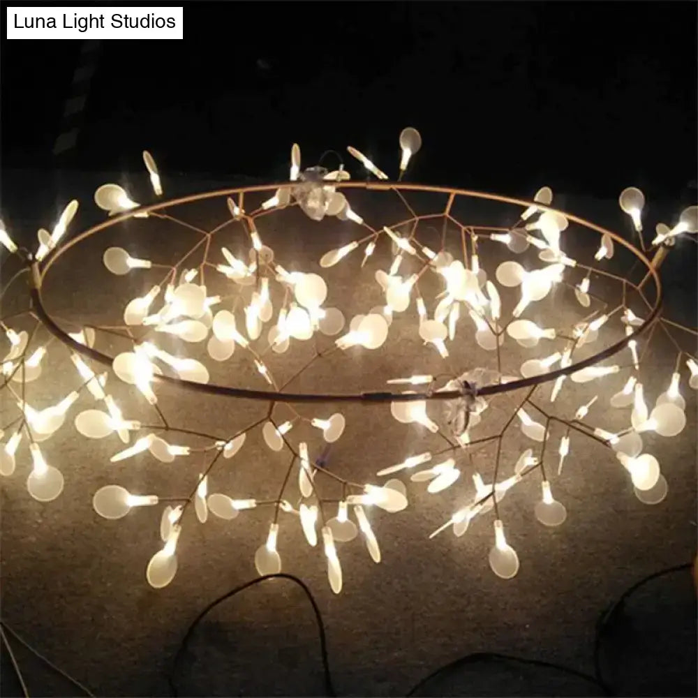 Modern copper tree branch pendant light with dark metal frame and white teardrop bulbs is a stylish led lamp