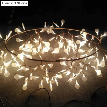 Modern copper tree branch pendant light with dark metal frame and white teardrop bulbs is a stylish led lamp