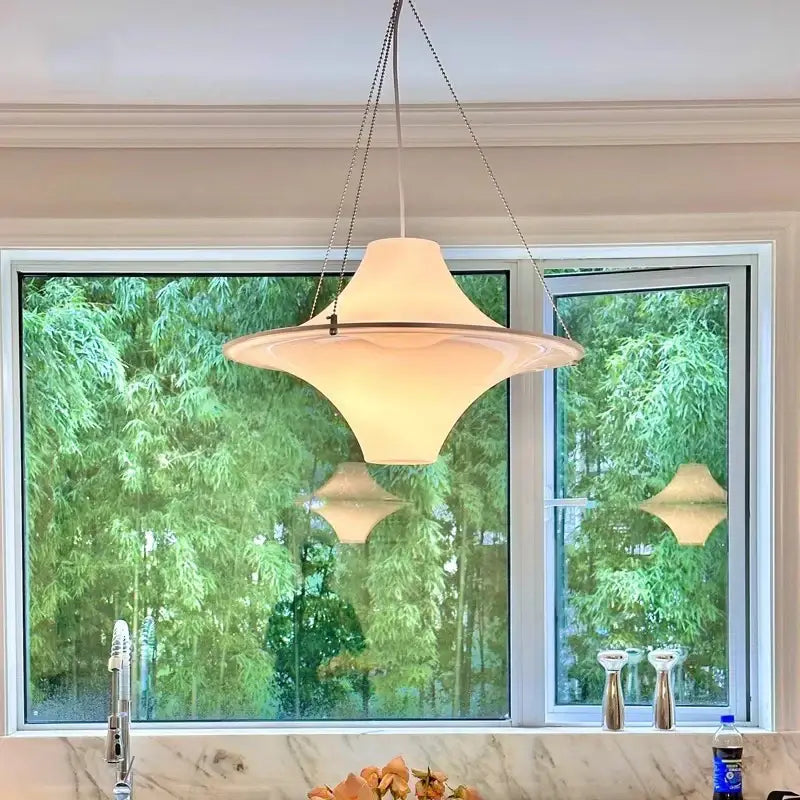 Modern cream acrylic ufo pendant light with cream-colored translucent glass and sleek design for dining room decorbites