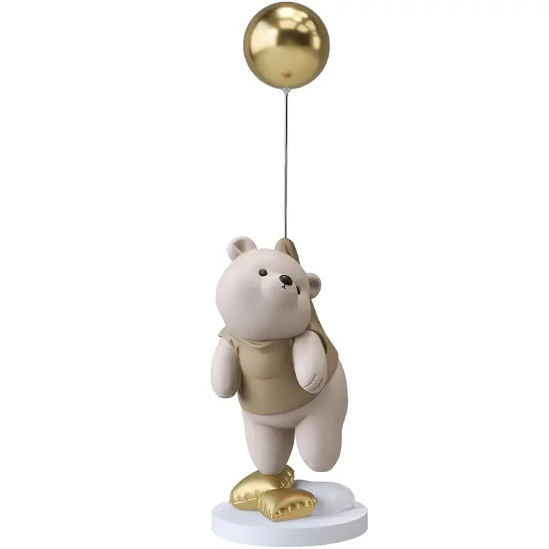 Modern cream and gold balloon polar bear resin figurine holding a golden balloon on a white base for office decor