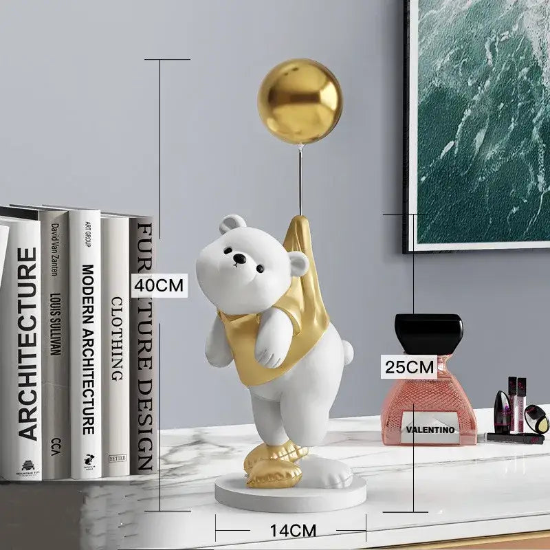 Modern cream and gold balloon polar bear resin figurine with gold accents holding a golden balloon for office desk decor