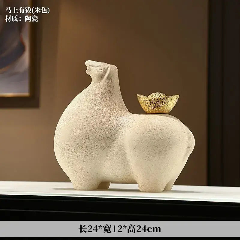 Cream-colored ceramic horse sculpture figurine with textured surface and gold ingot decorbites horse sculpture decor