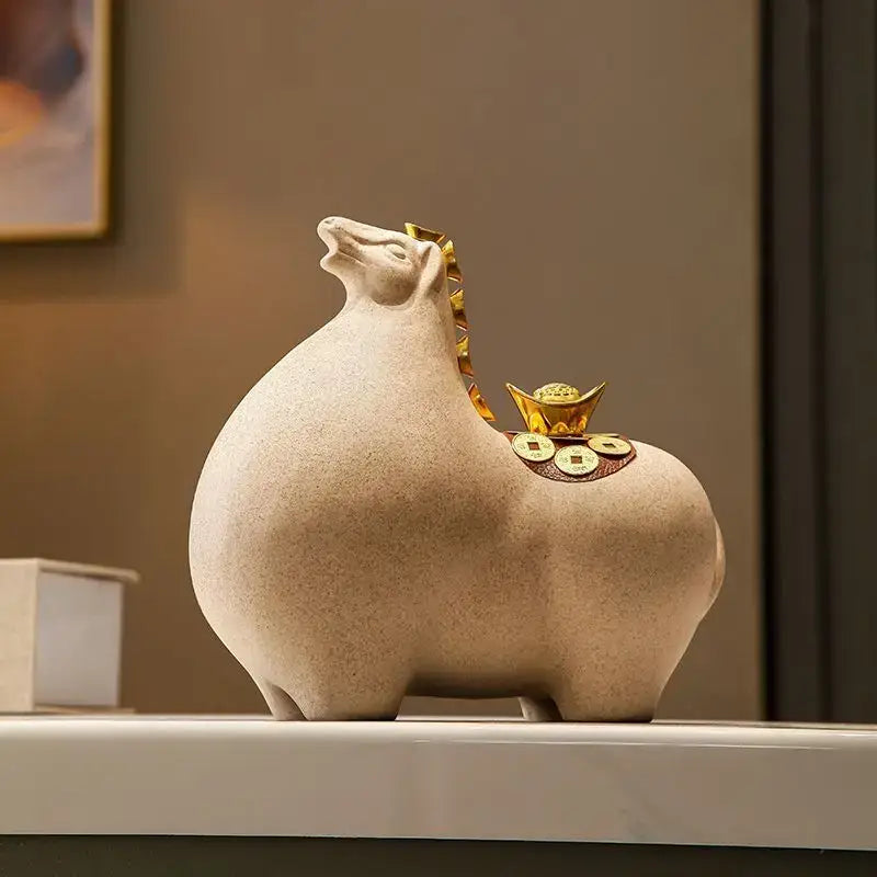 Modern cream and gold horse sculpture figurine with beige ceramic pig and decorative gold coins for living room decor
