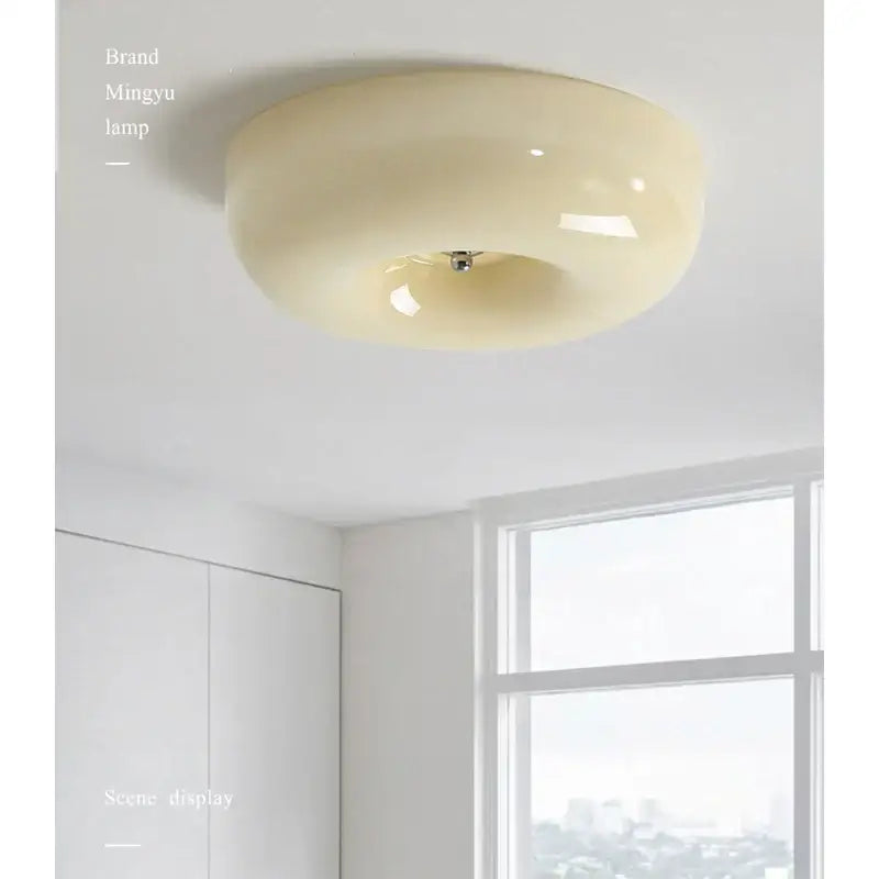 Cream-colored glossy acrylic ceiling lamp with modern minimalist design for bedroom decorbites cream bauhaus style
