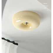 Modern cream bauhaus style ceiling lamp with glossy ceramic finish and metallic center fixture for bedroom decorbites decor