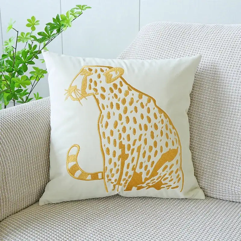 White cushion with embroidered golden leopard design in modern cream and black embroidered leopard pillowcase home decor