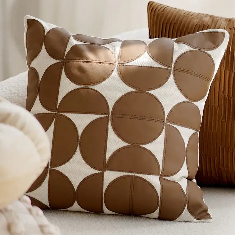 A decorbites brown coffee textured throw pillow with modern geometric overlapping circular patches on cream base