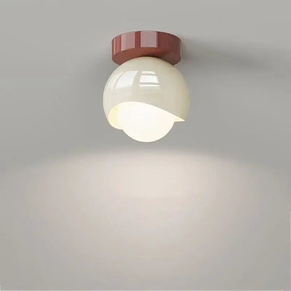 Modern cream and brown glass iron led ceiling lamp with a cream spherical light and matte red base for bedroom decorbites ceiling lamp