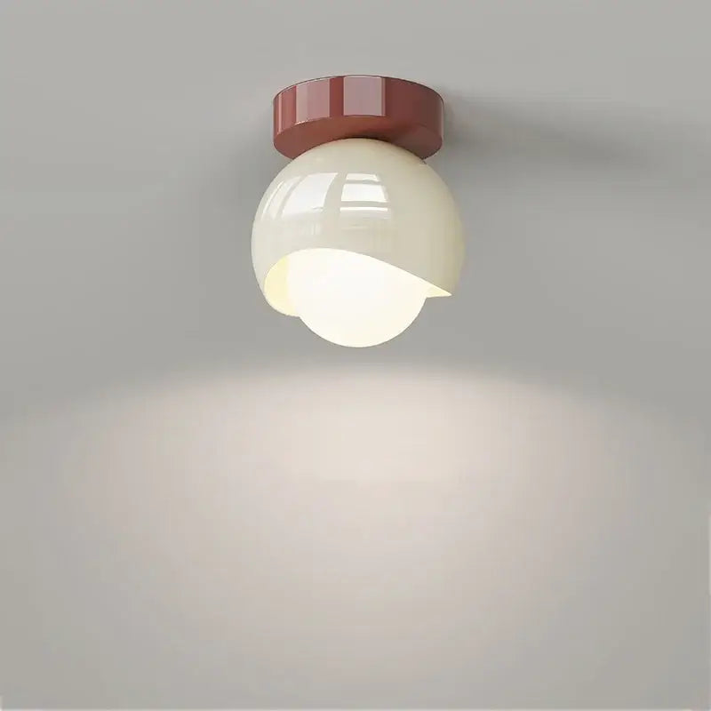 Modern cream and brown glass iron led ceiling lamp with a cream spherical light and matte red base for bedroom decorbites ceiling lamp