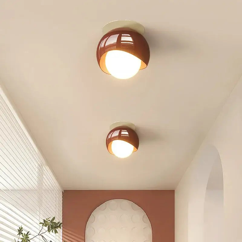 Two warm-toned brown dome-shaped glass iron led ceiling lamp lights from decorbites with modern minimalist design