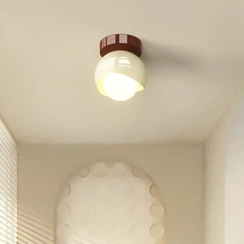 Modern cream and brown glass iron led ceiling lamp with a glossy glass globe and ridged metal base for bedroom decorbites ceiling lamp