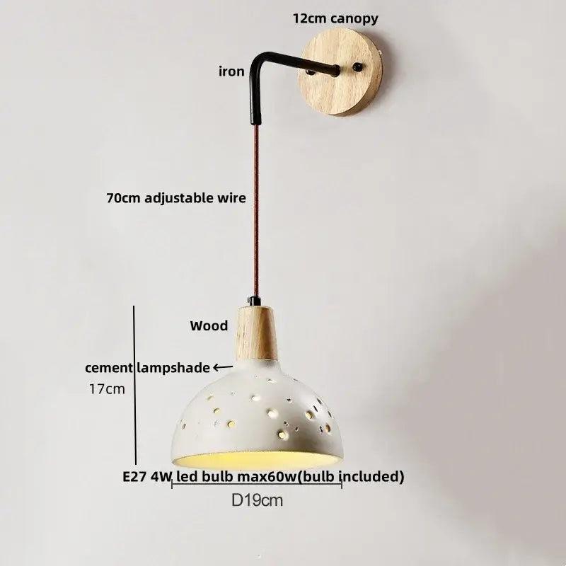 Modern cream ceramic and wood wall light with perforated shade and iron arm for decorbites cement wood wall decor