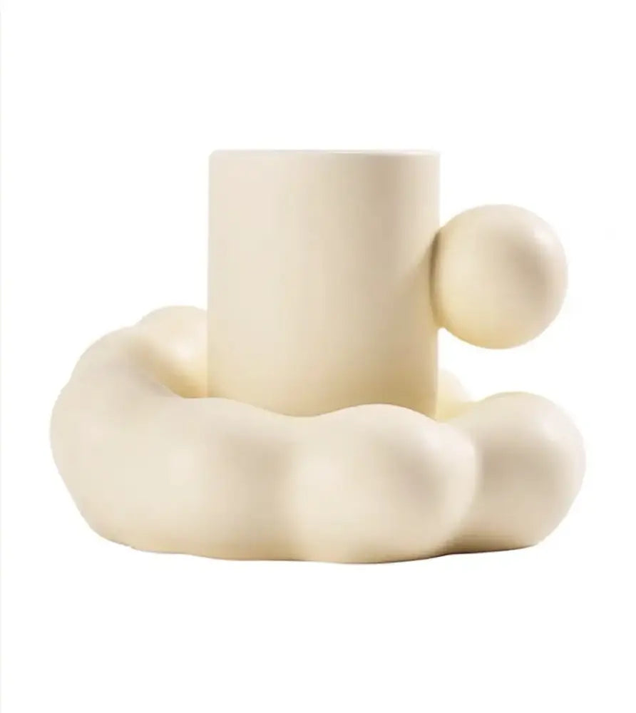 Modern cream ceramic cup and saucer set with a cylindrical body and rounded cloud base from decorbites cotton candy