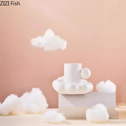 Modern cream ceramic cup and saucer set with a cloud-shaped base designed by zizi fish for decorbites cotton candy